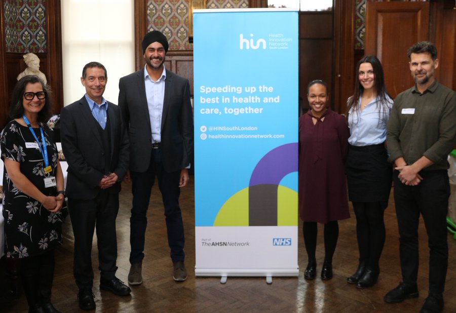 Speakers pose next to HIN Banner at the January MSK Improvement Network Event