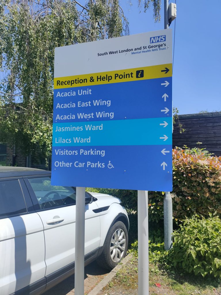A sign showing different ward names