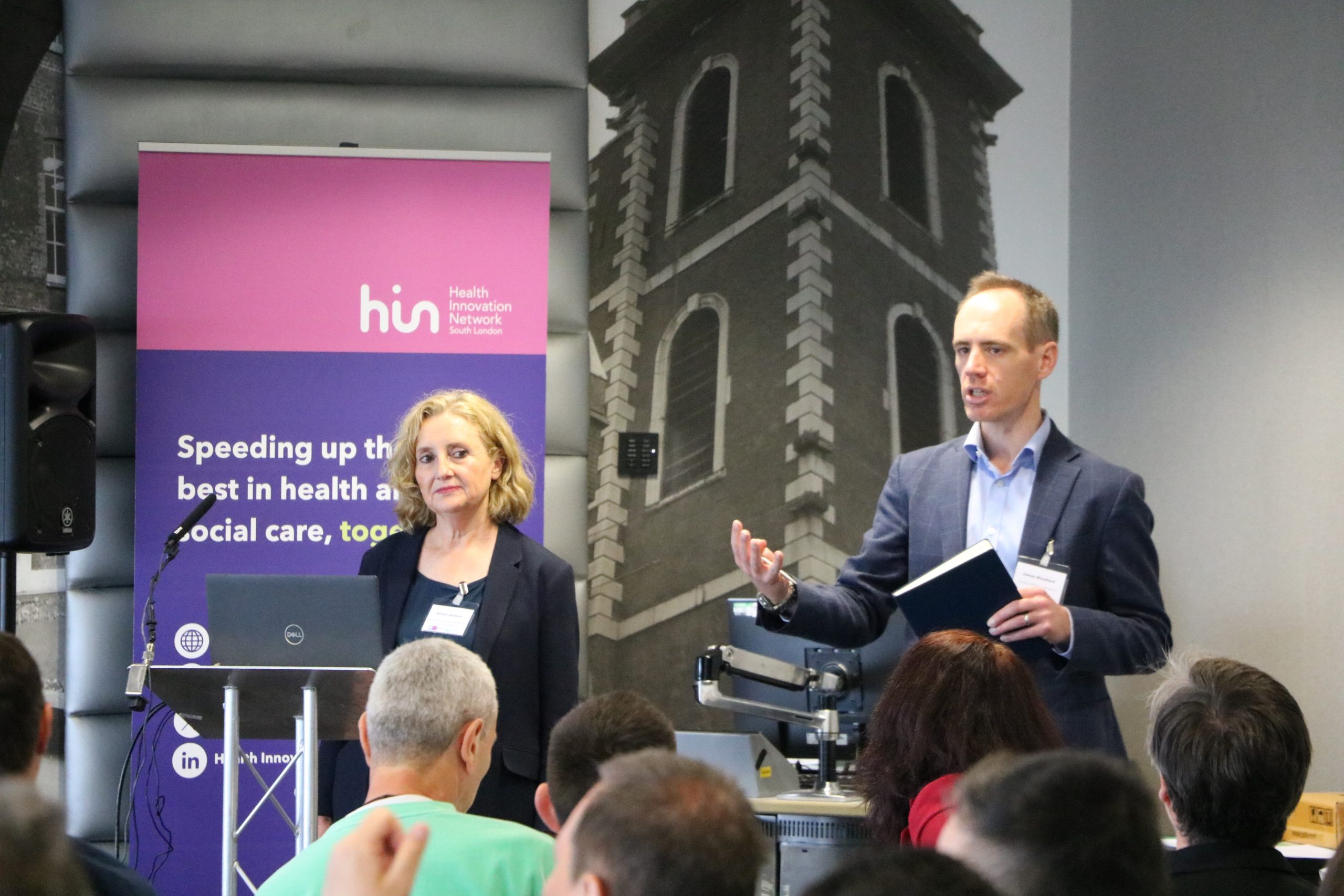 Man and woman presenting at an event