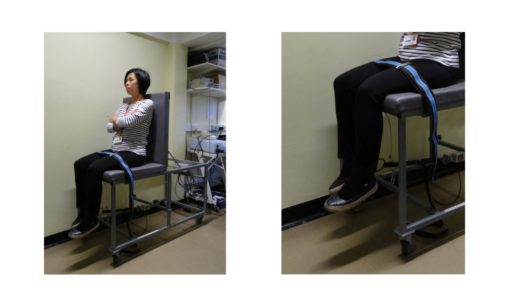 Woman using a strain gauge to test isometric leg strength